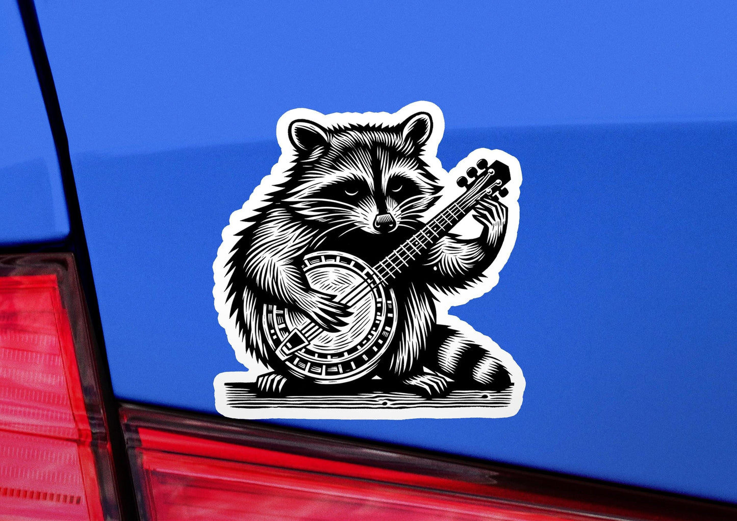a sticker of a raccoon playing a guitar