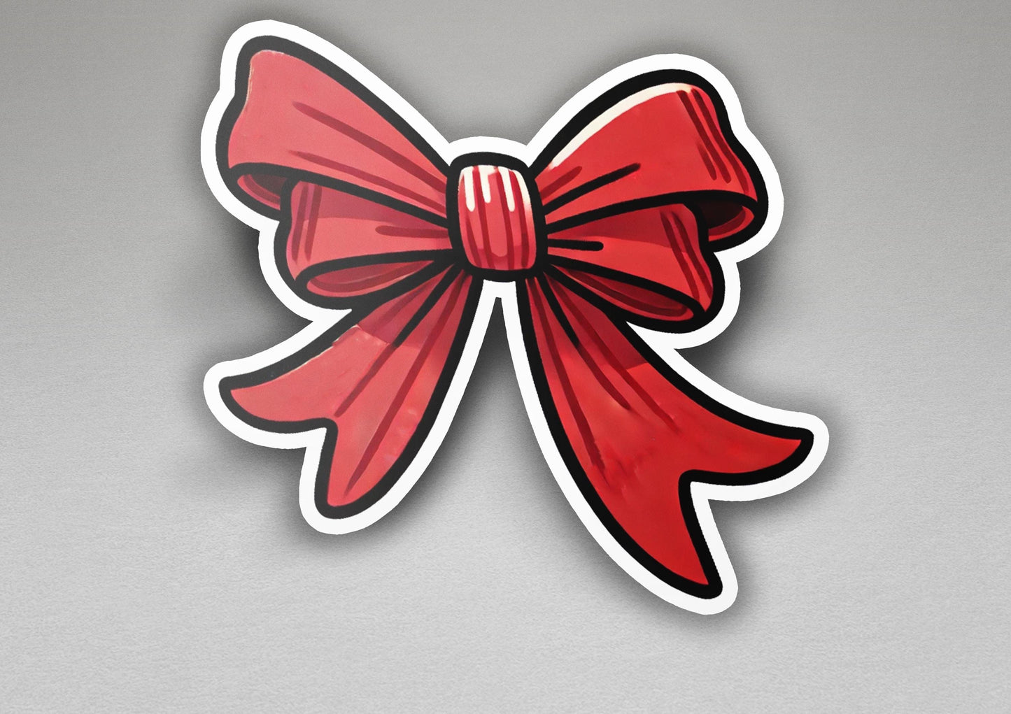a sticker of a red bow on a gray background
