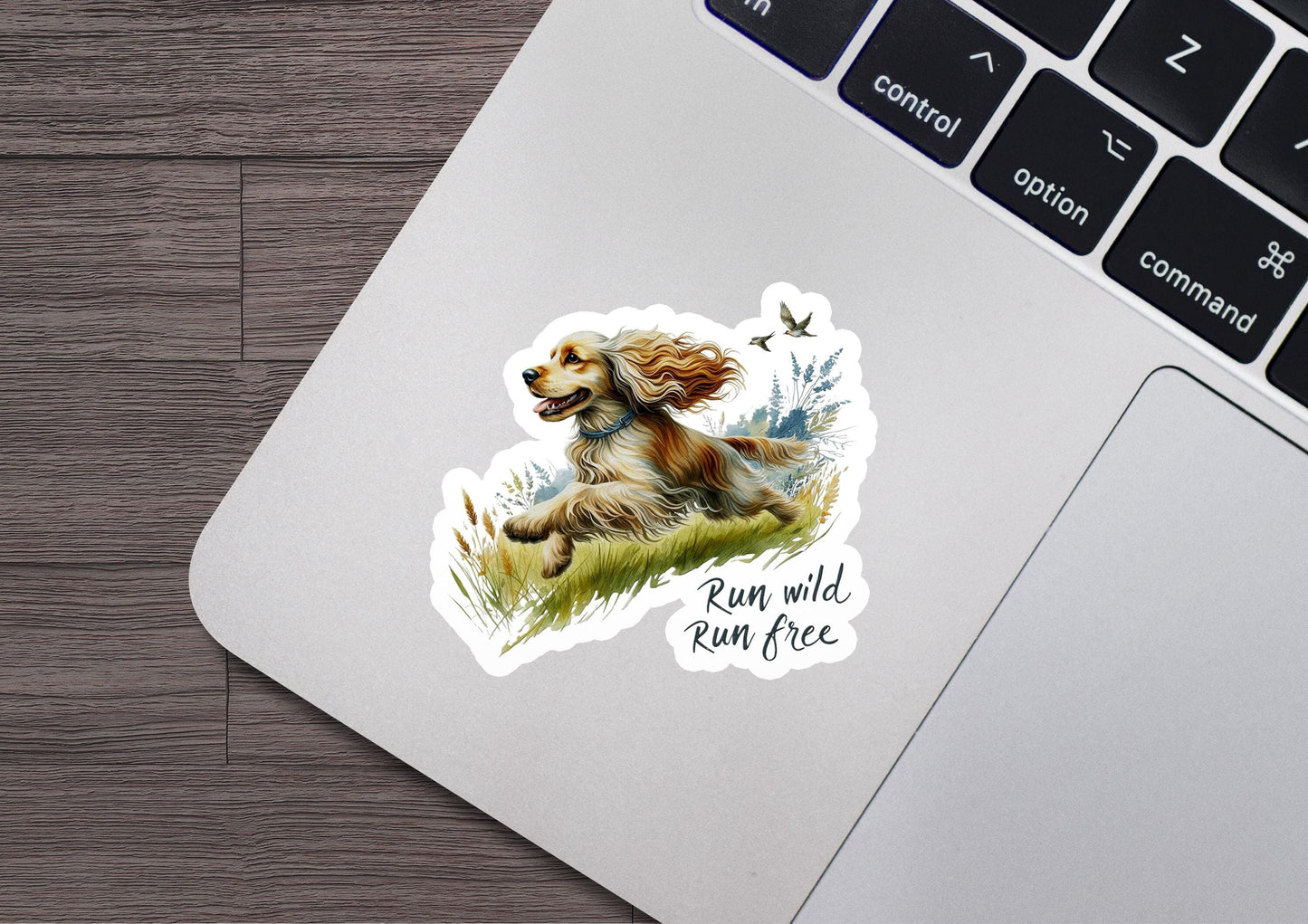 a sticker of a dog sitting on top of a laptop