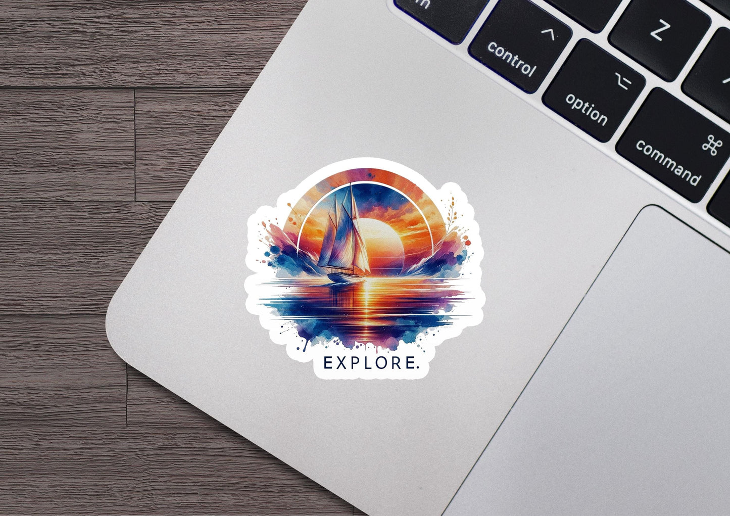 a laptop with a sticker of a sailboat on it