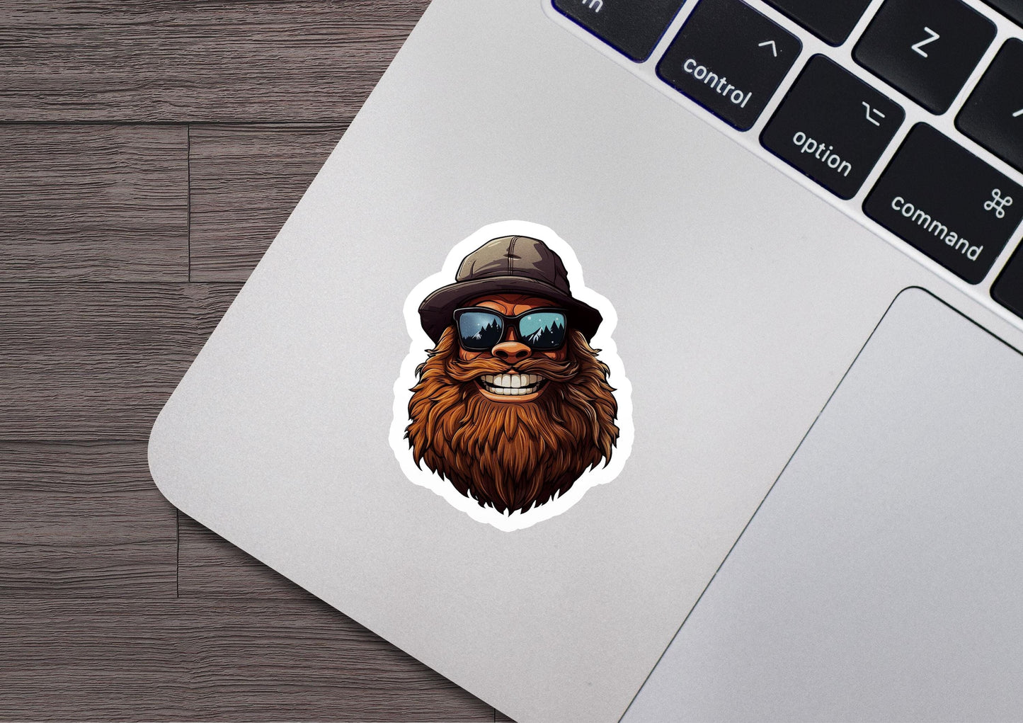 a laptop with a sticker of a bear wearing a hat and sunglasses