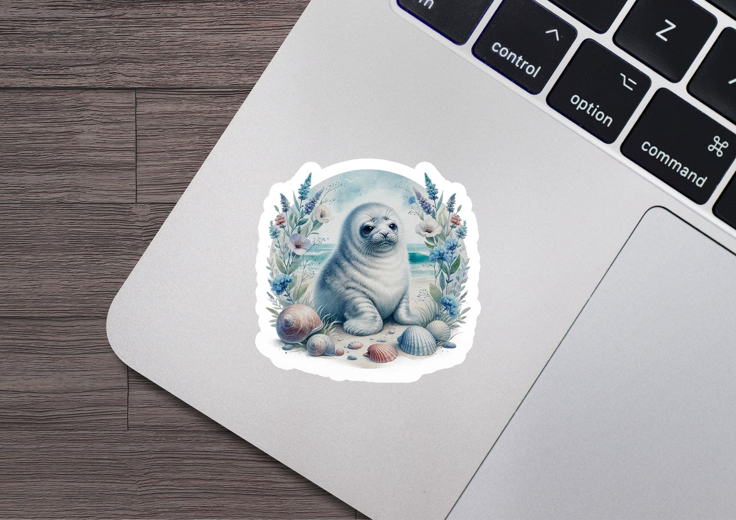 a sticker of a seal on a laptop