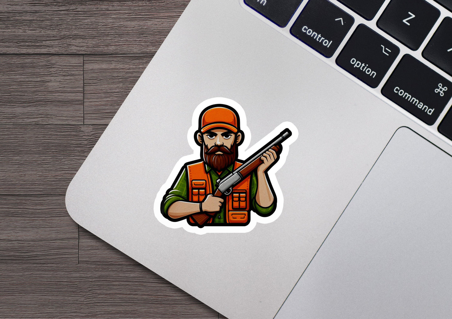 a sticker of a man with a gun on a laptop