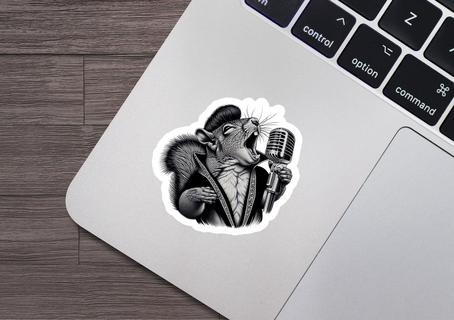 a sticker of a rat holding a microphone