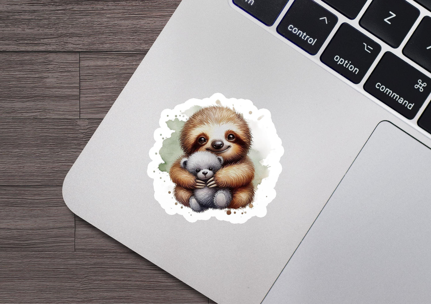 a sticker of a baby sloth holding a stuffed animal