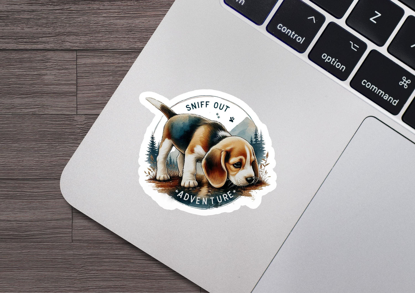 a sticker of a dog sitting on top of a laptop