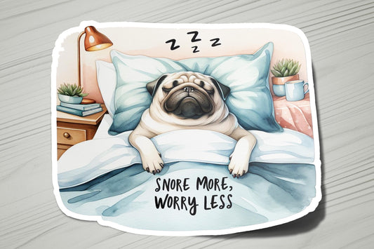 a pug dog laying in a bed with a pillow