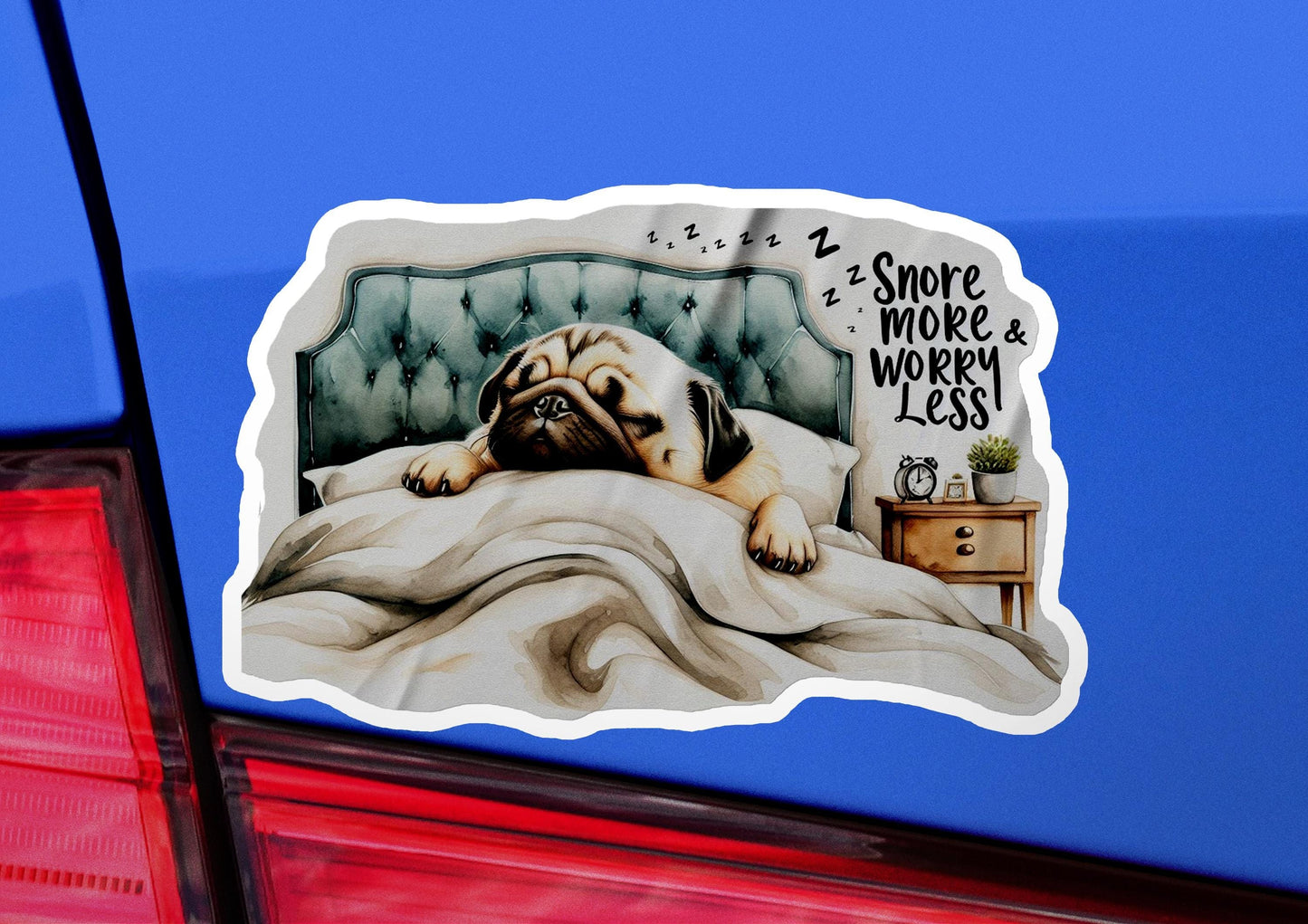 a sticker of a dog sleeping on a bed