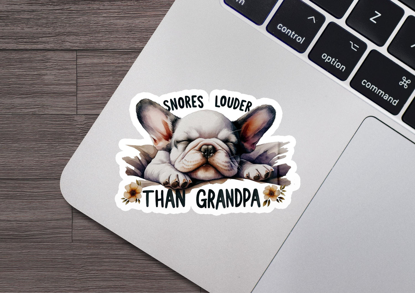 a sticker of a bulldog with leaves on it