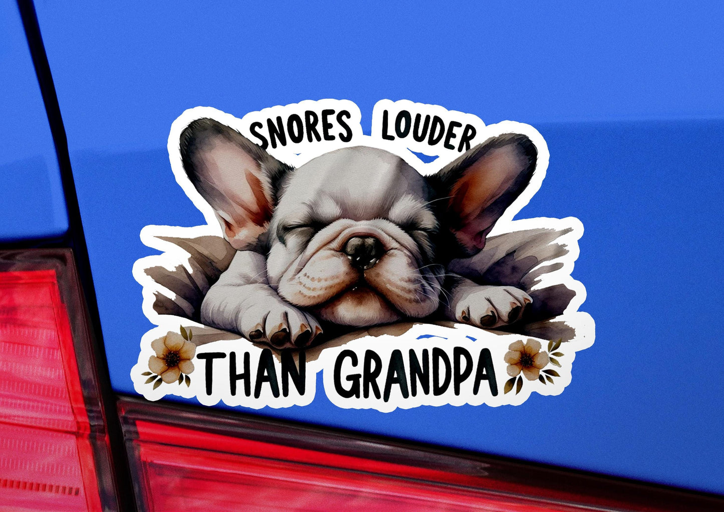 a sticker of a dog is shown on the back of a car