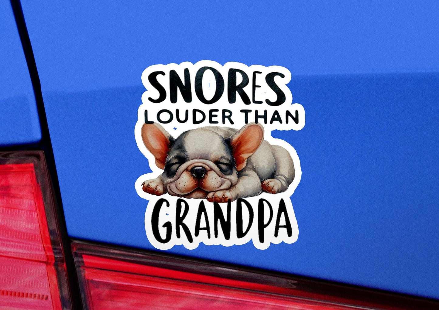 a sticker of a dog sleeping on the back of a car