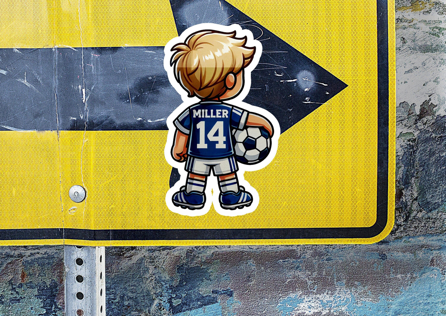 a sticker of a boy holding a soccer ball