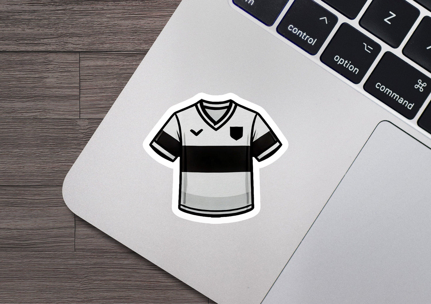 a sticker of a soccer jersey on a laptop