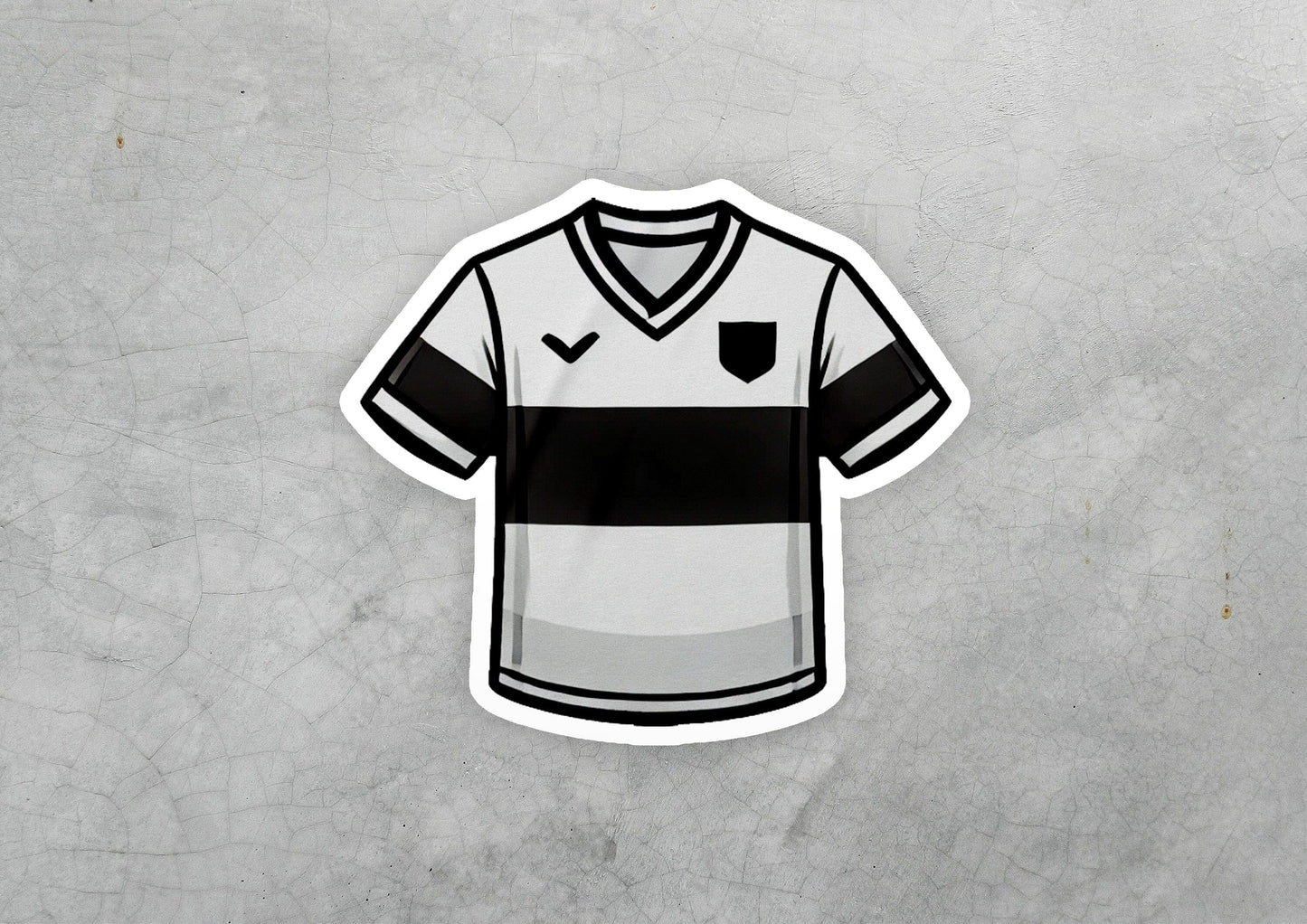 a sticker of a soccer jersey on a concrete surface