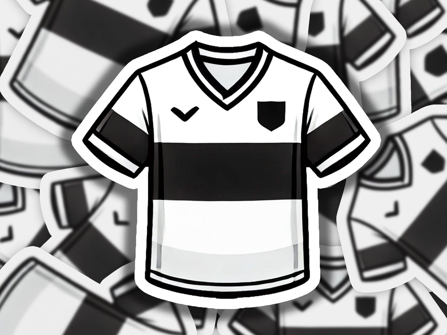 a black and white soccer jersey surrounded by black and white soccer balls