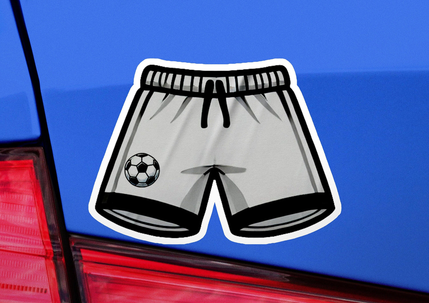 a sticker of a soccer shorts on the back of a car