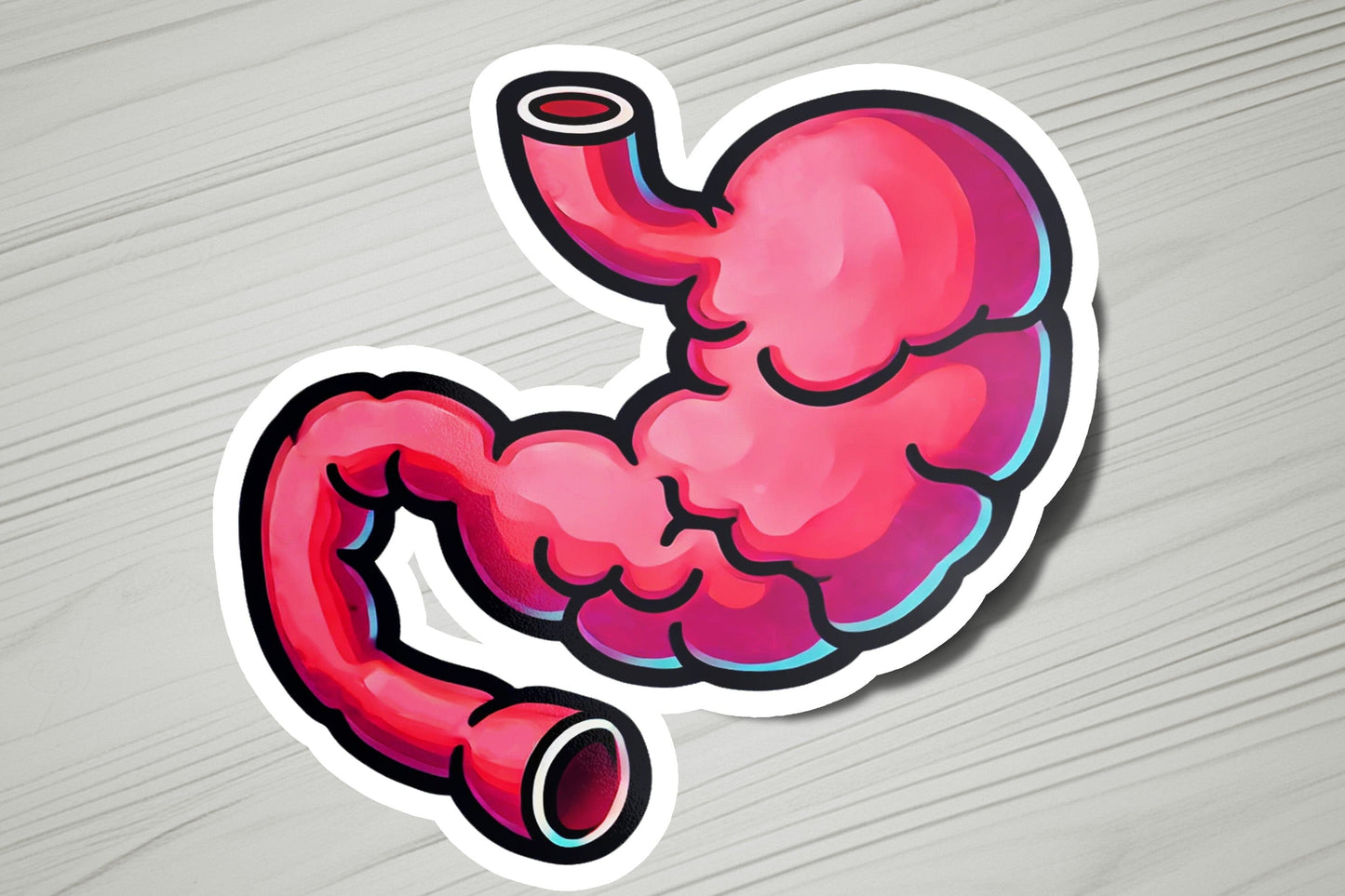 a sticker of a pink stomach on a wooden surface