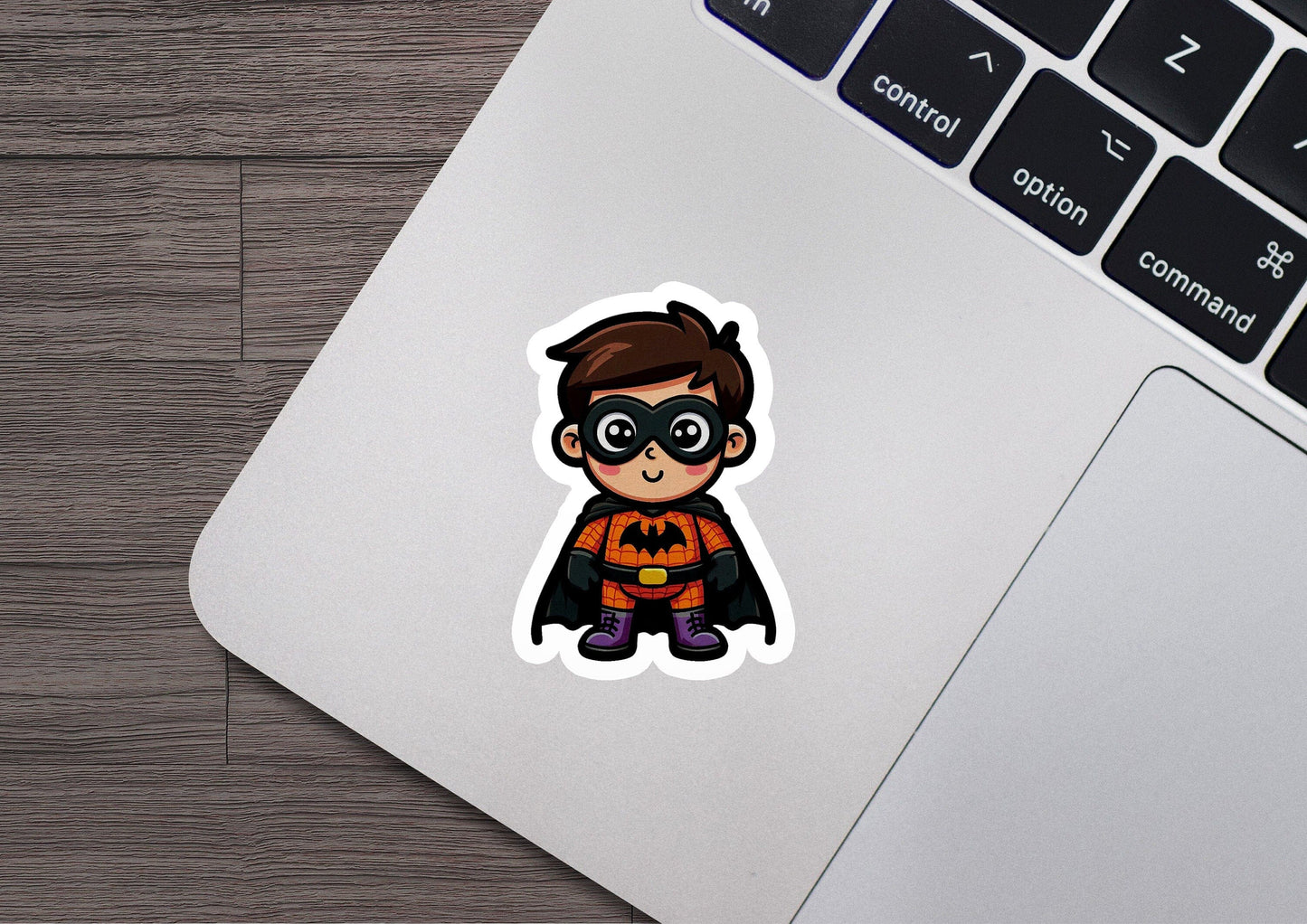 a sticker of a little boy dressed as a bat