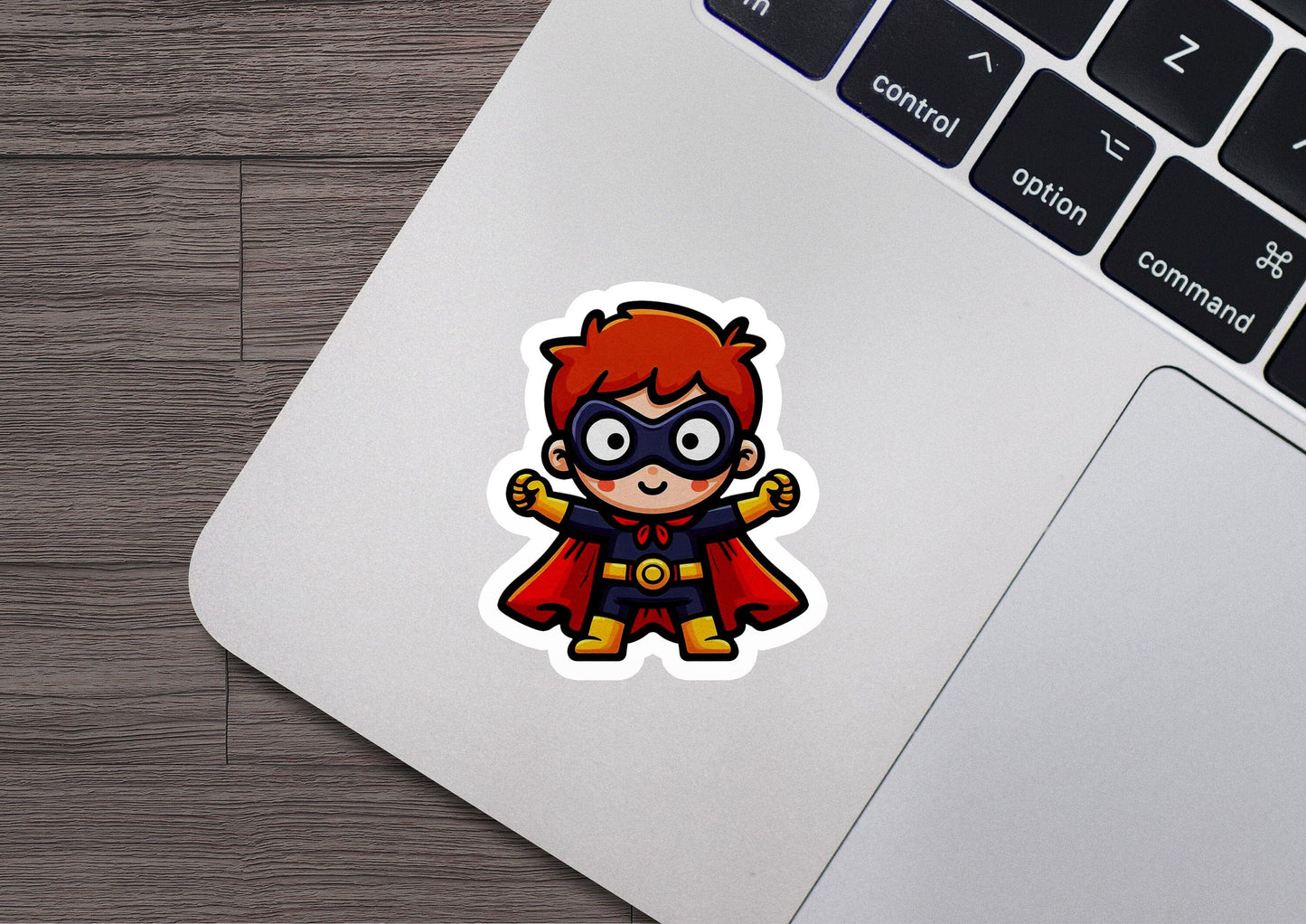 a laptop with a sticker of a cartoon character