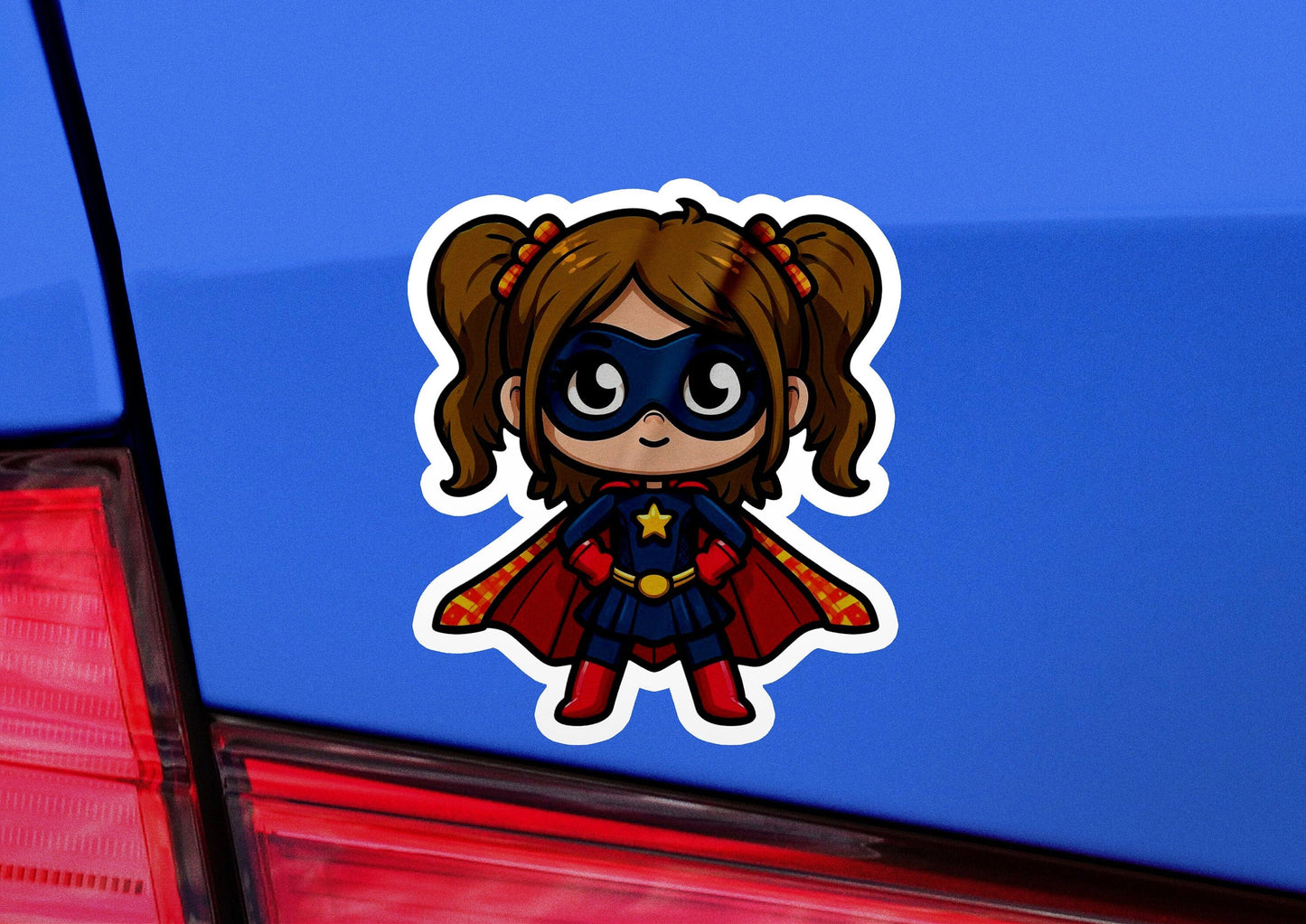 a sticker of a little girl dressed as a superhero