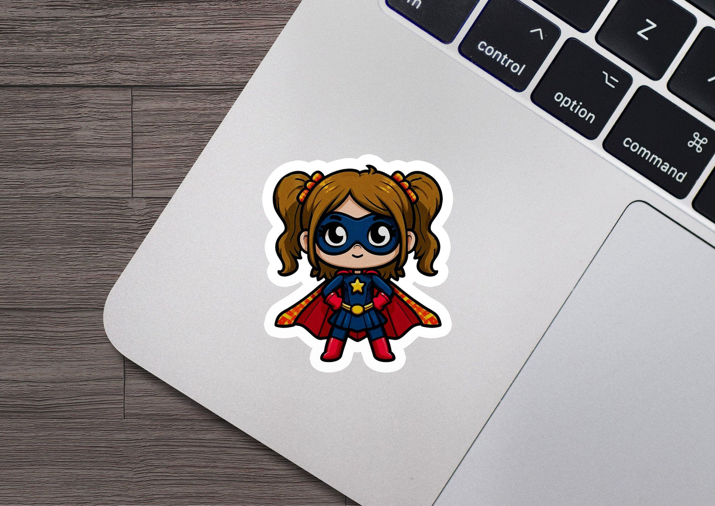 a sticker of a little girl with a cape