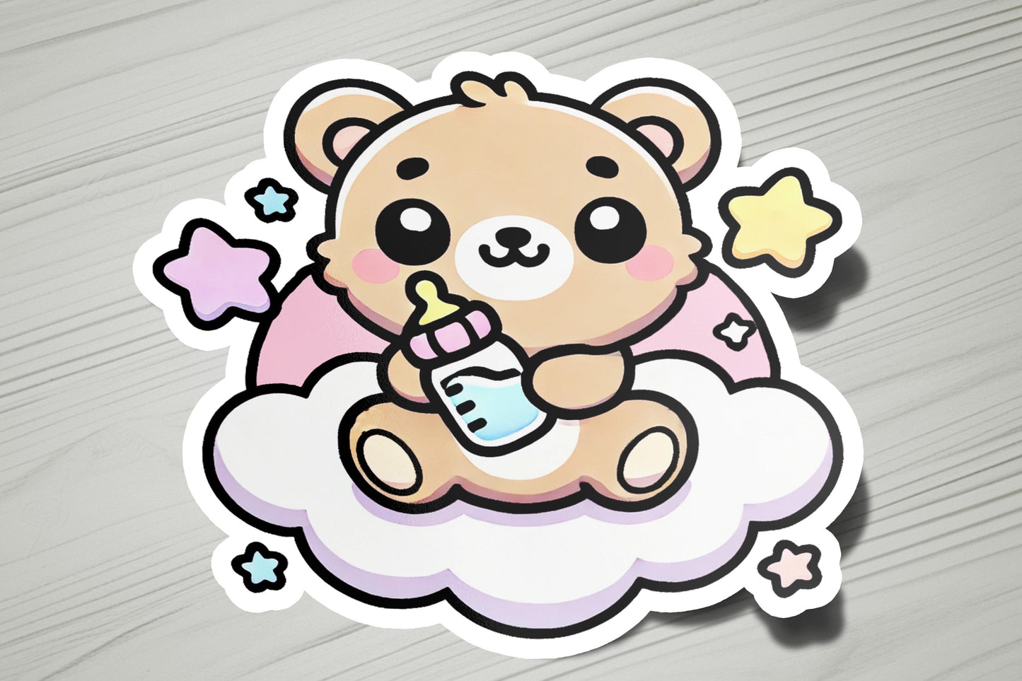 a sticker of a teddy bear sitting on top of a cloud