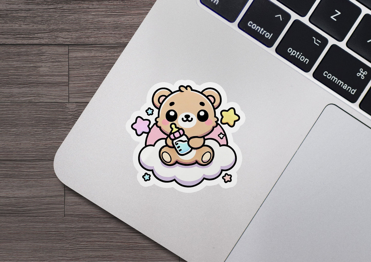 a sticker of a teddy bear sitting on a cloud