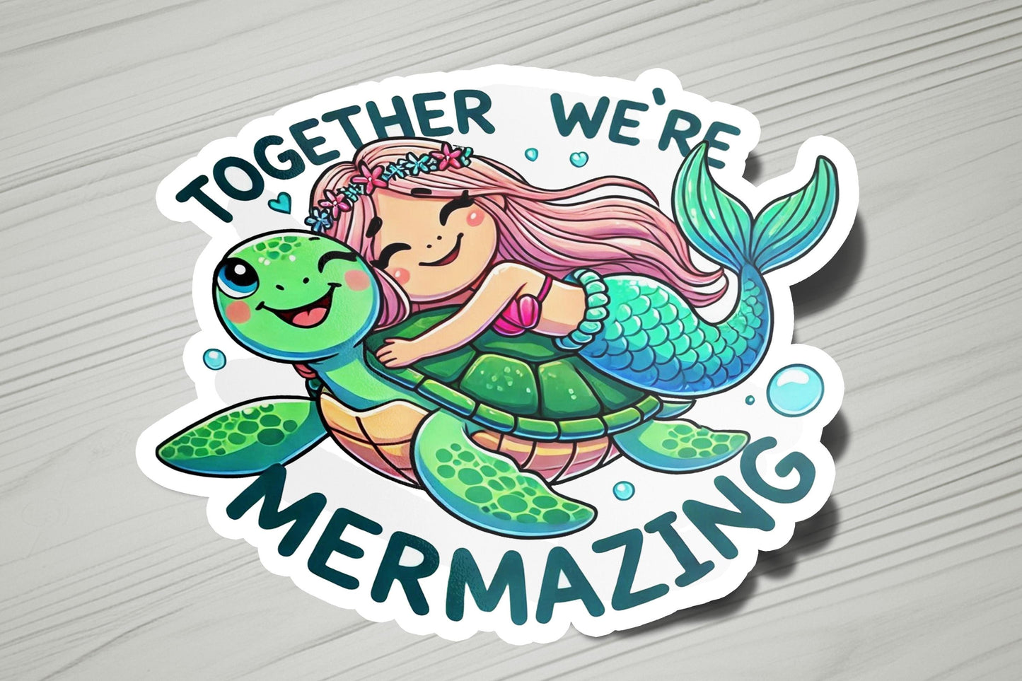 a sticker with a mermaid hugging a turtle