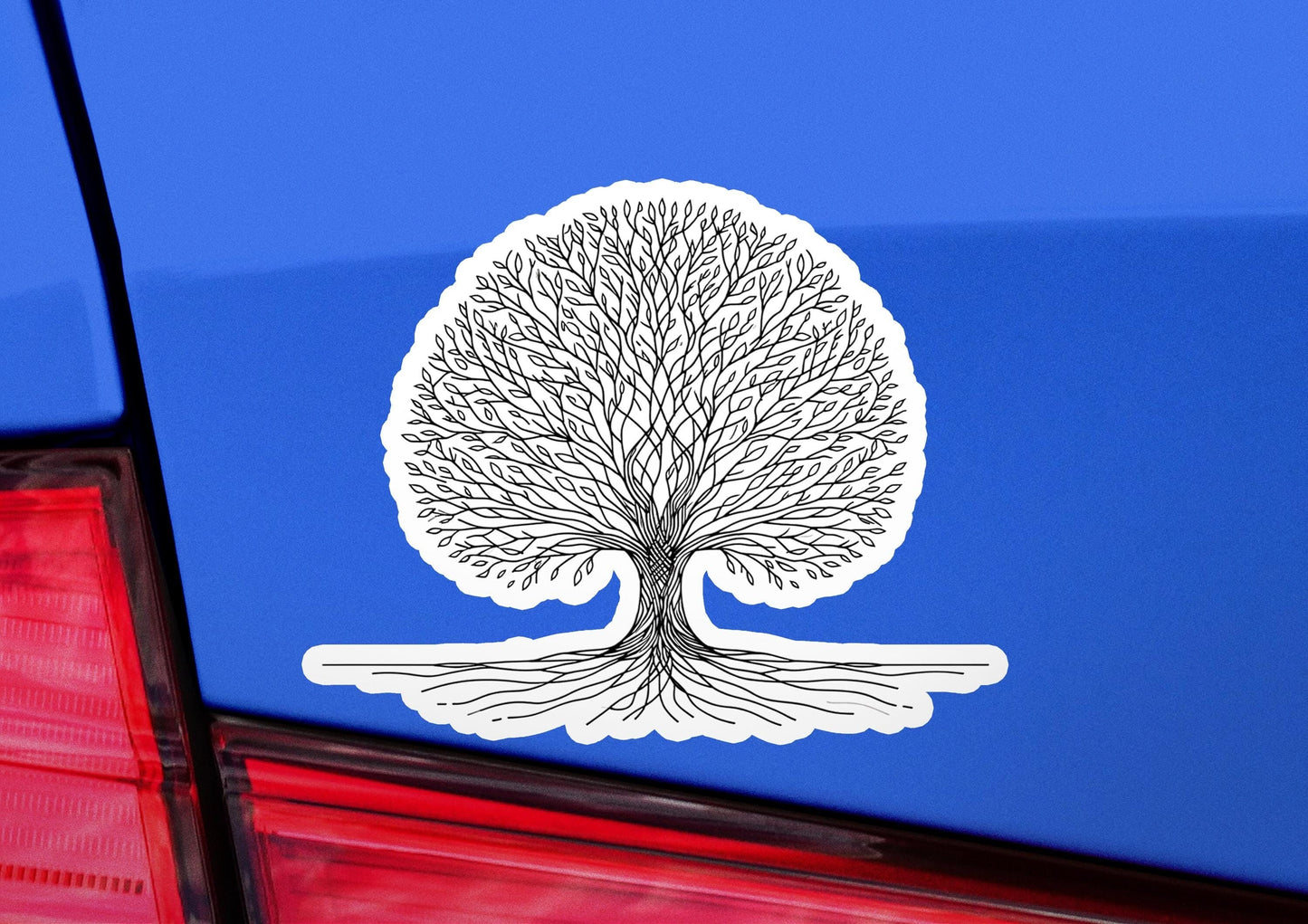 a sticker of a tree on the back of a car