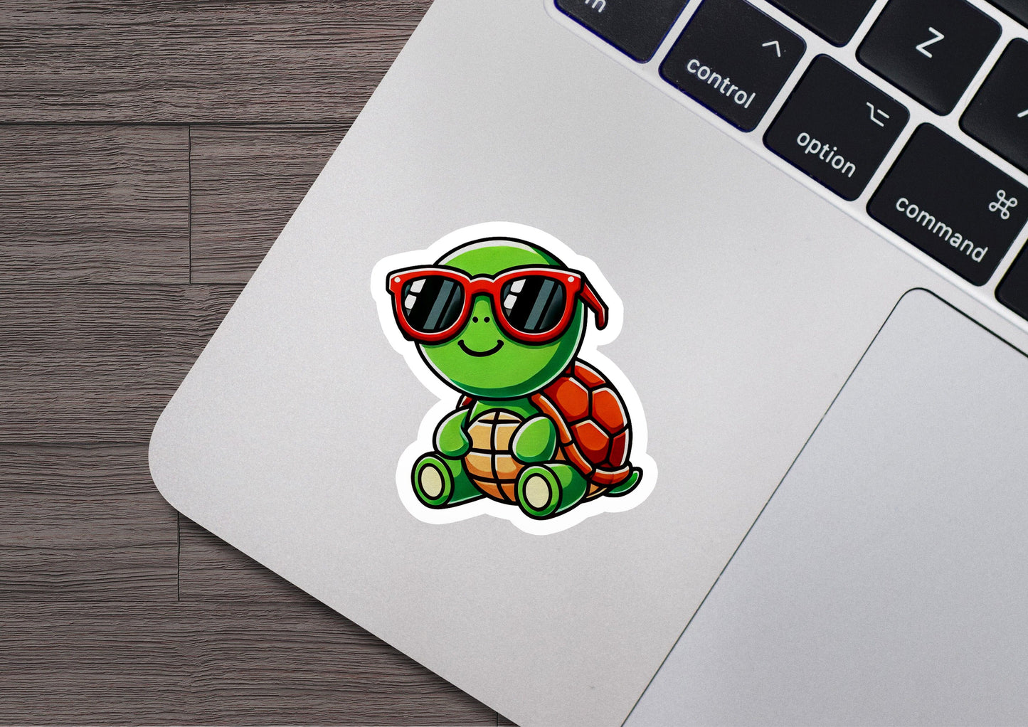 a laptop with a sticker of a turtle wearing sunglasses