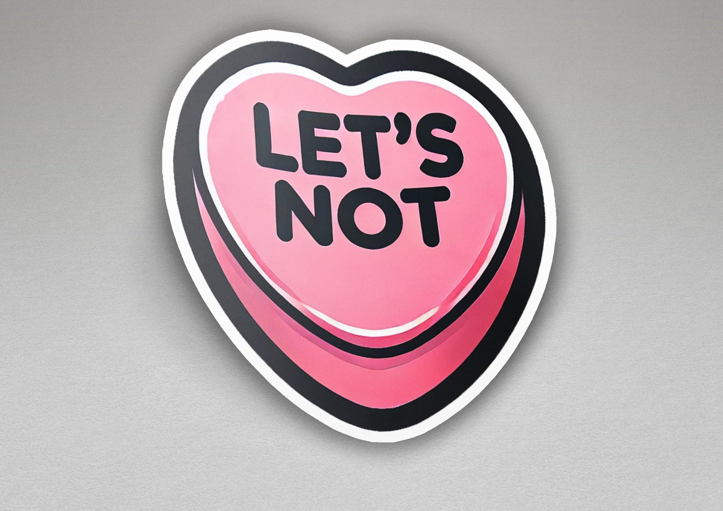 a heart shaped sticker that says let's not