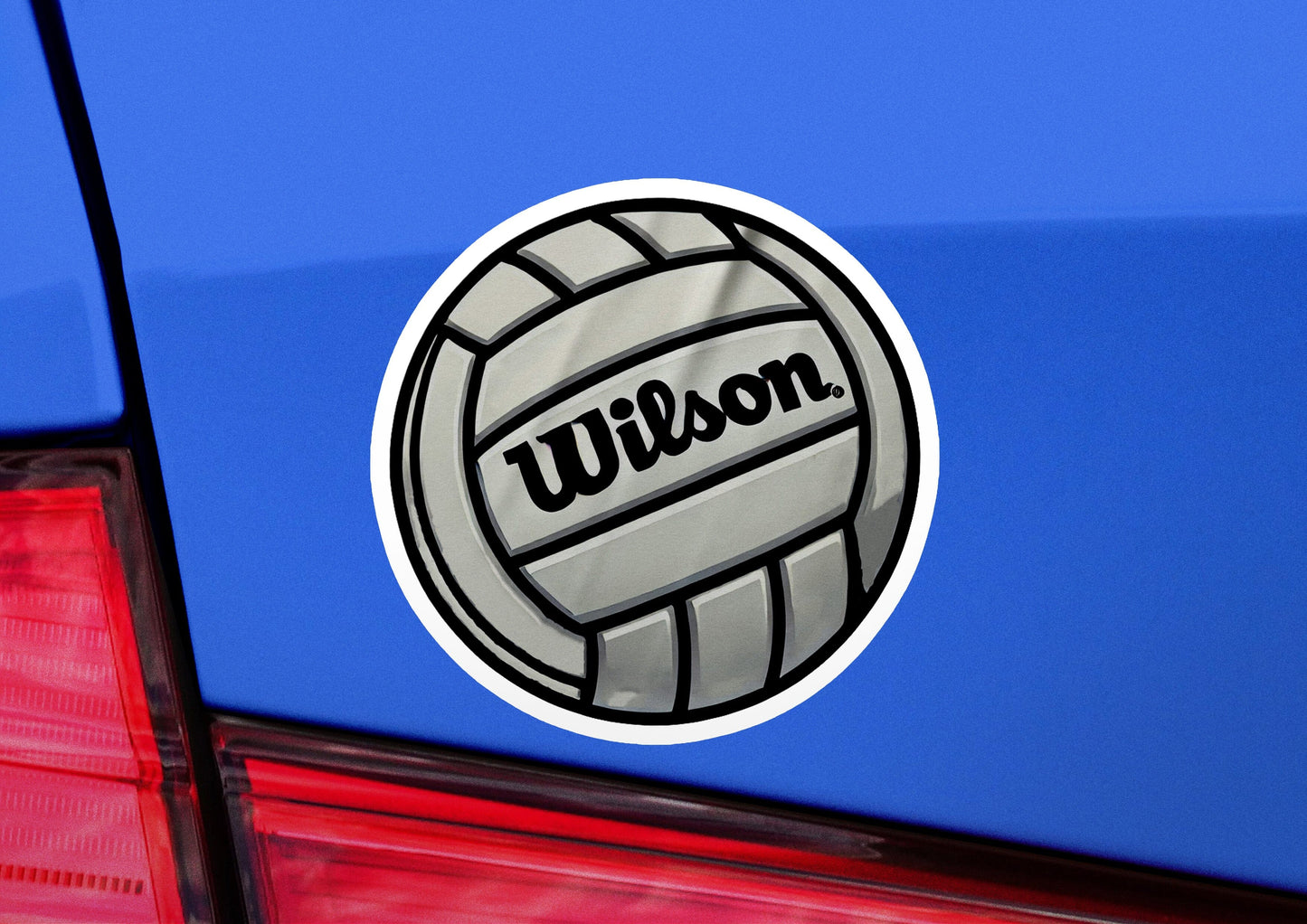 a sticker of a volleyball on the back of a car