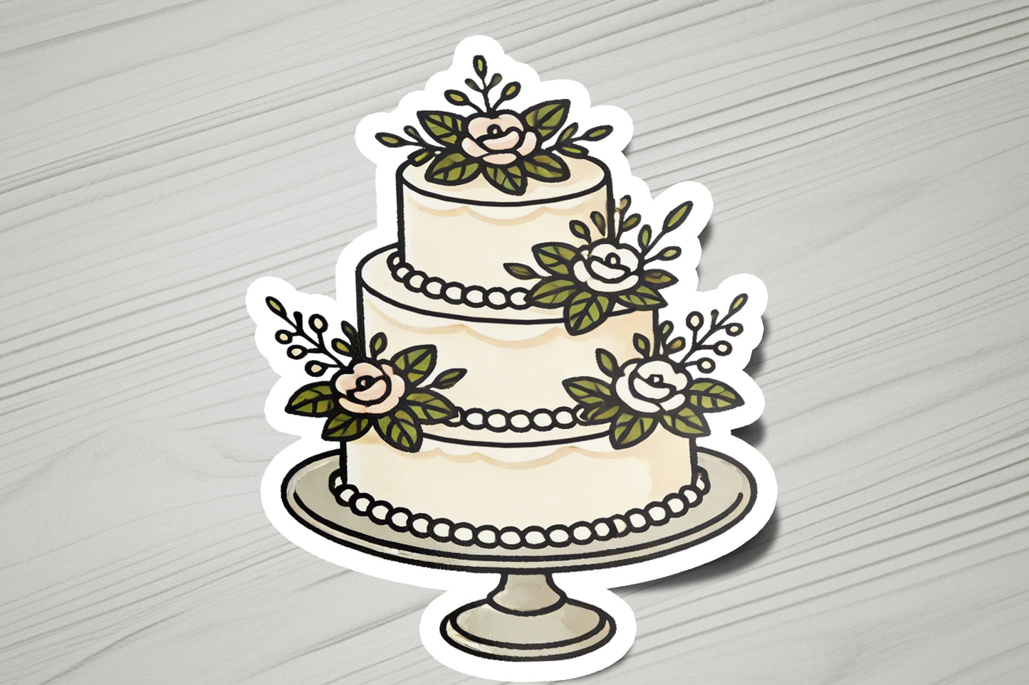 a sticker of a wedding cake with flowers on it
