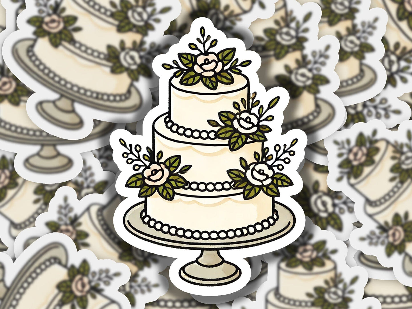 a sticker of a wedding cake with flowers on it