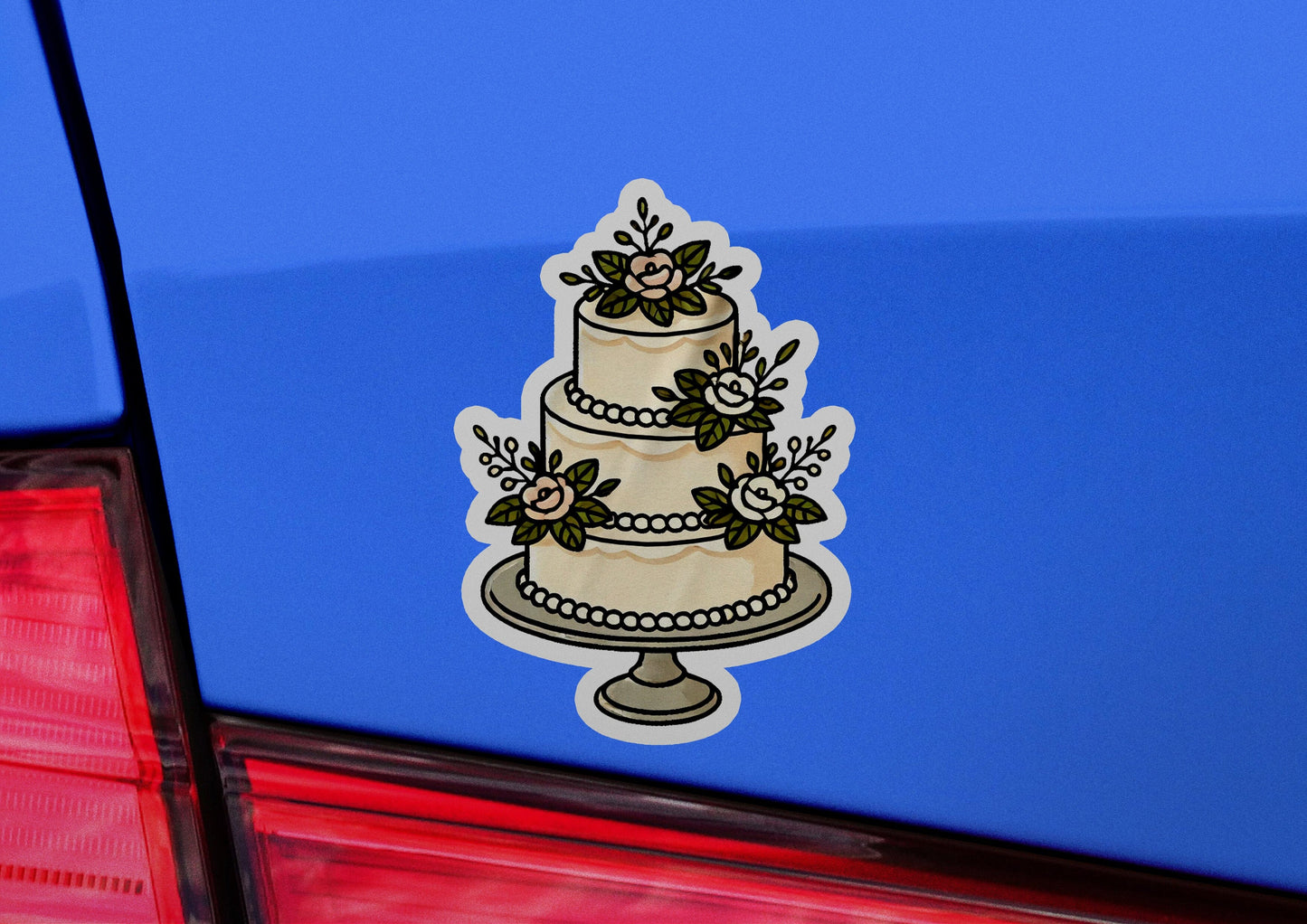 a wedding cake sticker on the back of a car