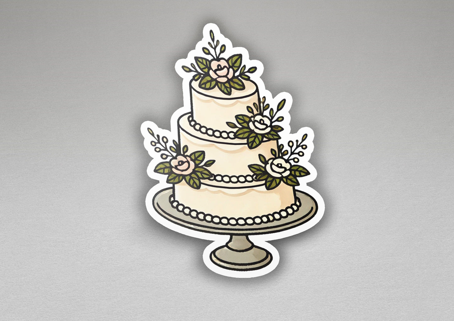 a sticker of a wedding cake with flowers on it