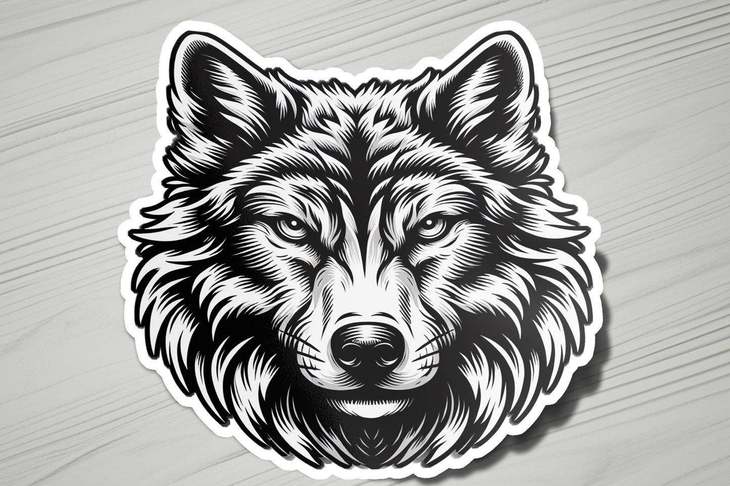 a sticker of a wolf's head on a wooden surface