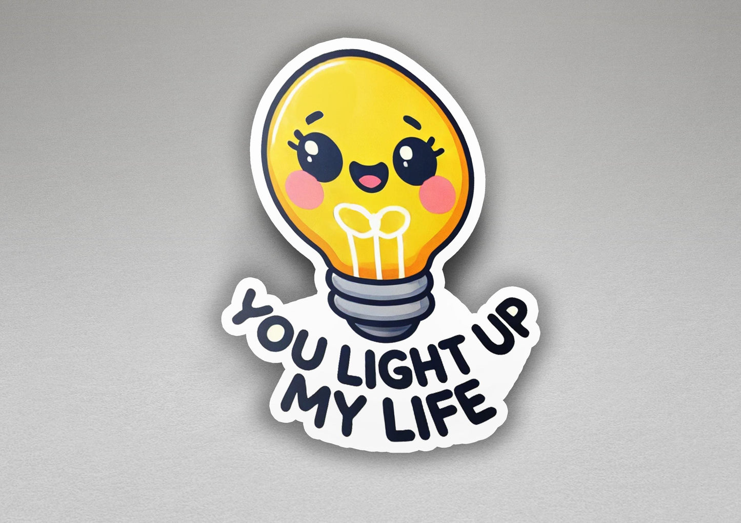 a yellow light bulb sticker that says you light up my life