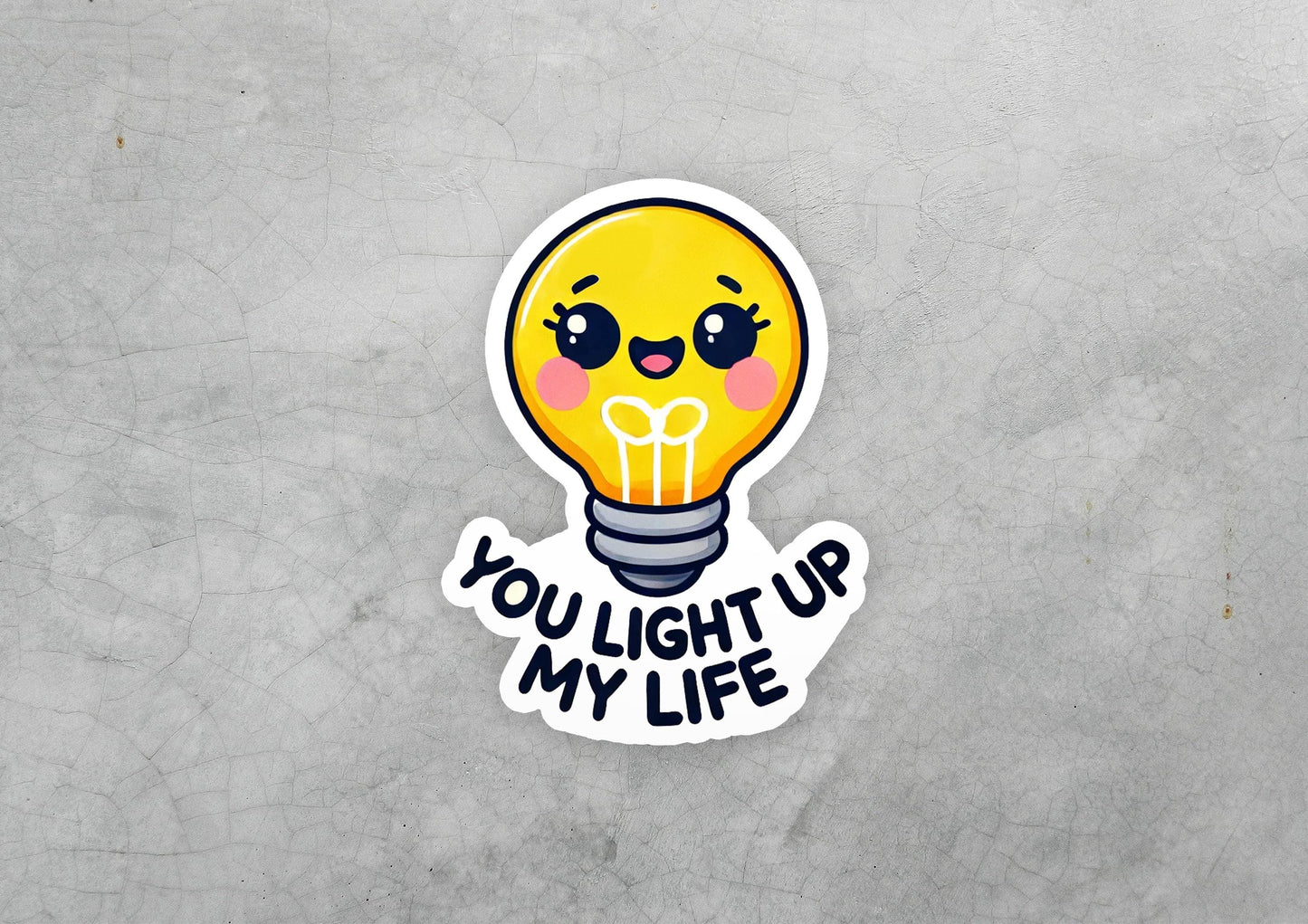 a sticker with a light bulb saying you light up my life