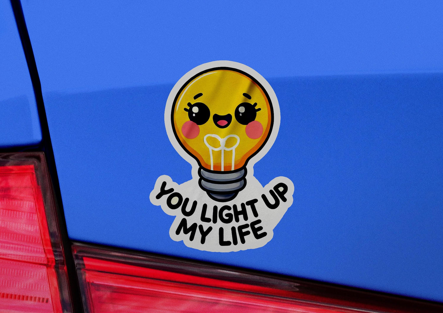 a sticker of a light bulb with the words you light up my life