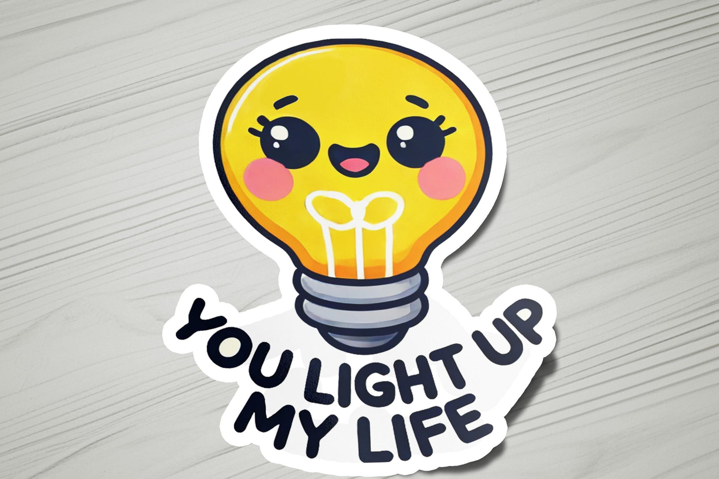 a sticker that says you light up my life