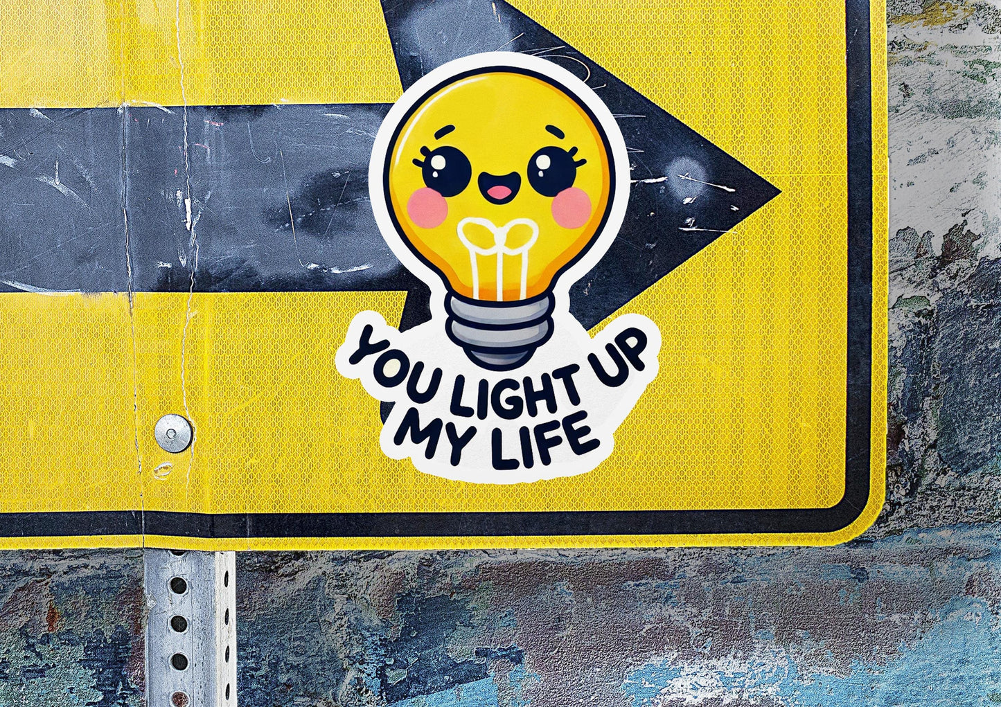 a yellow street sign with a light bulb sticker on it