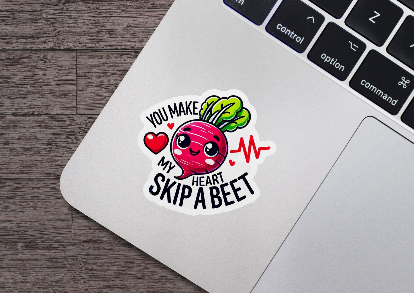 a laptop with a sticker of a beet on it
