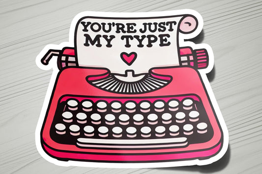 a sticker of a typewriter with the words you're just my type