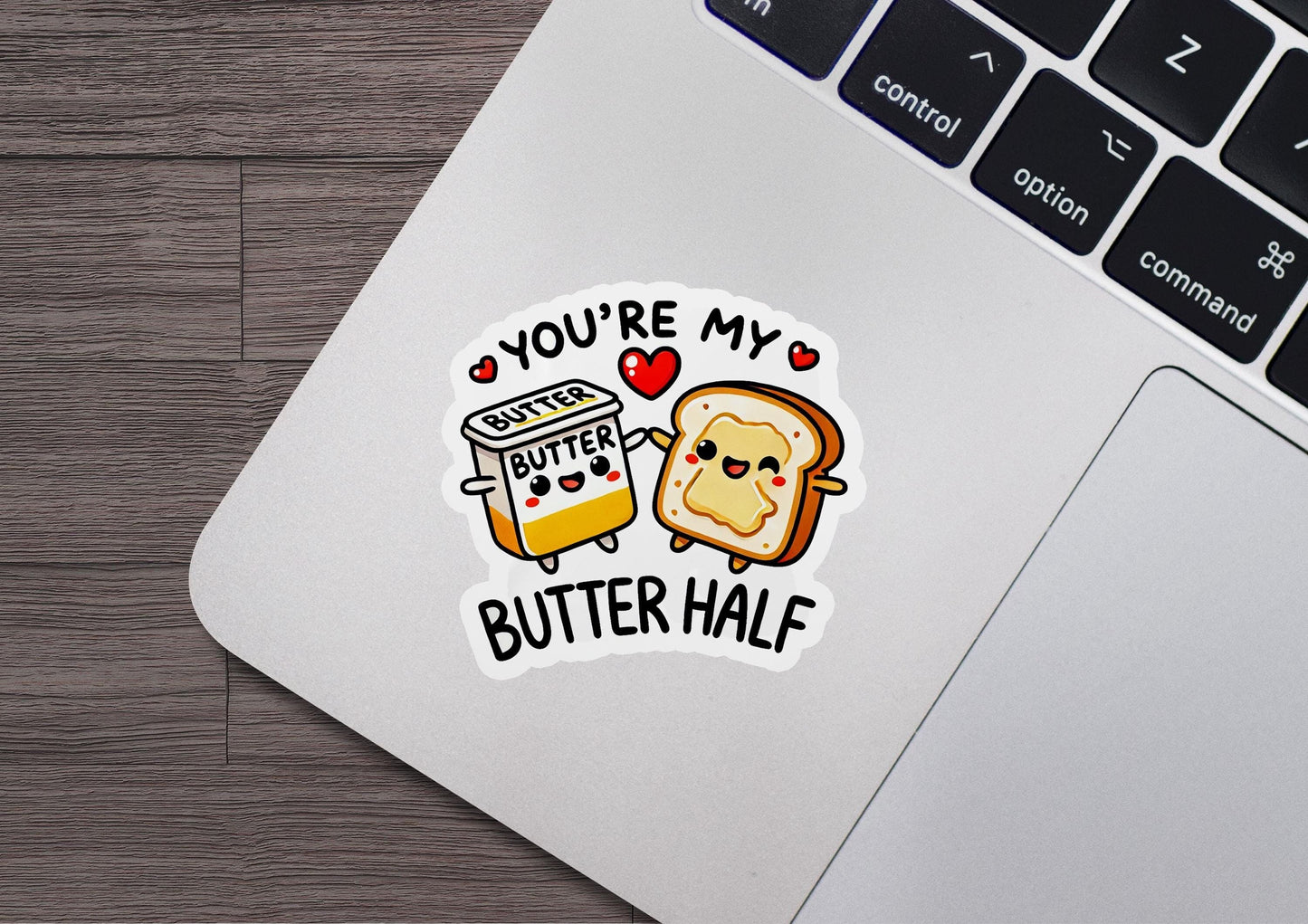 a laptop with a sticker of a peanut butter and jelly sandwich