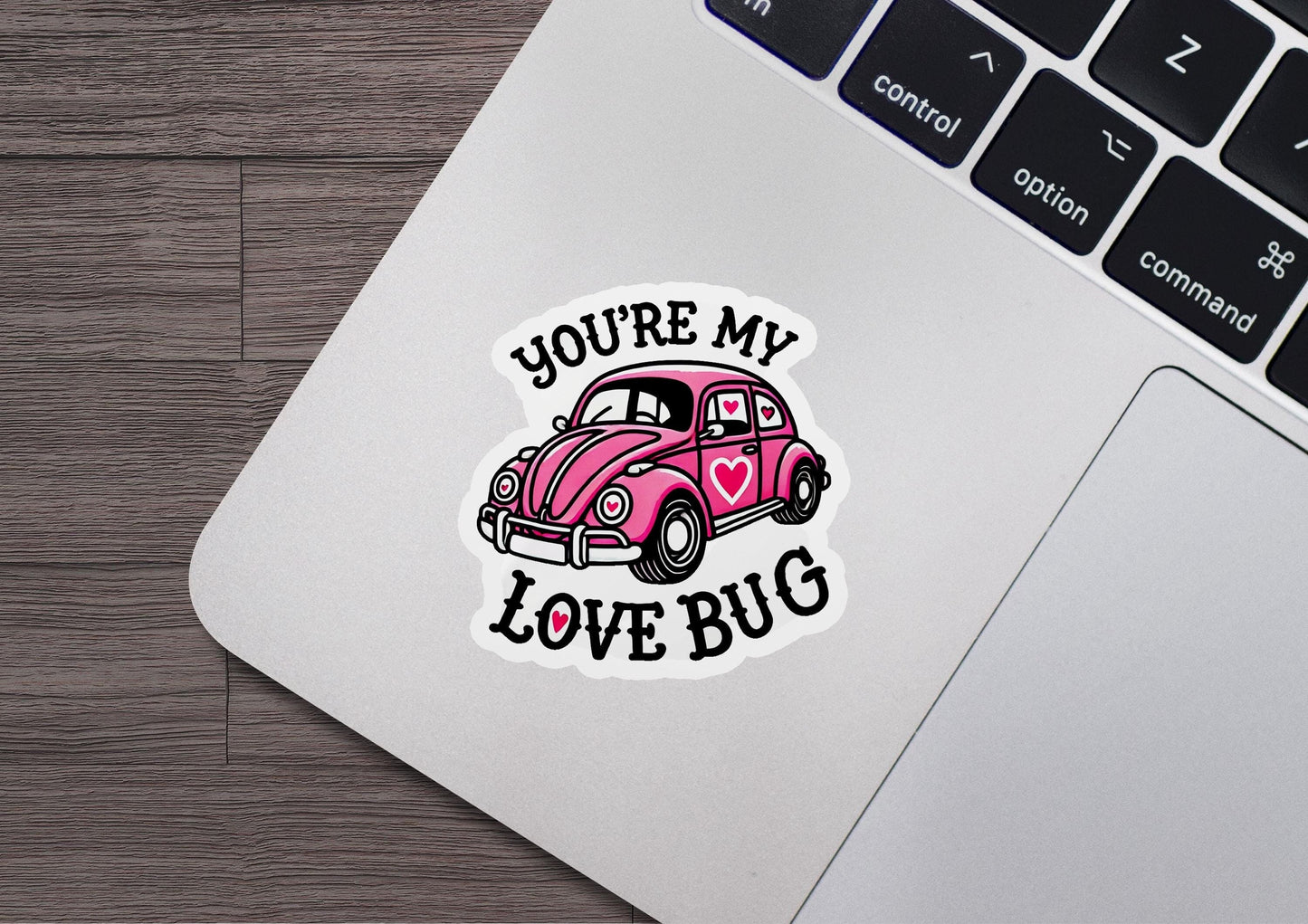 a sticker that says you're my love bug on a laptop