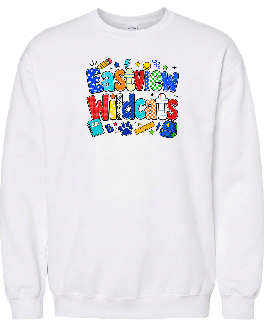 A white sweatshirt with a colorful graphic design featuring the text "Eastview Wildcats" and various school-related icons such as a backpack, pencil, and eraser.