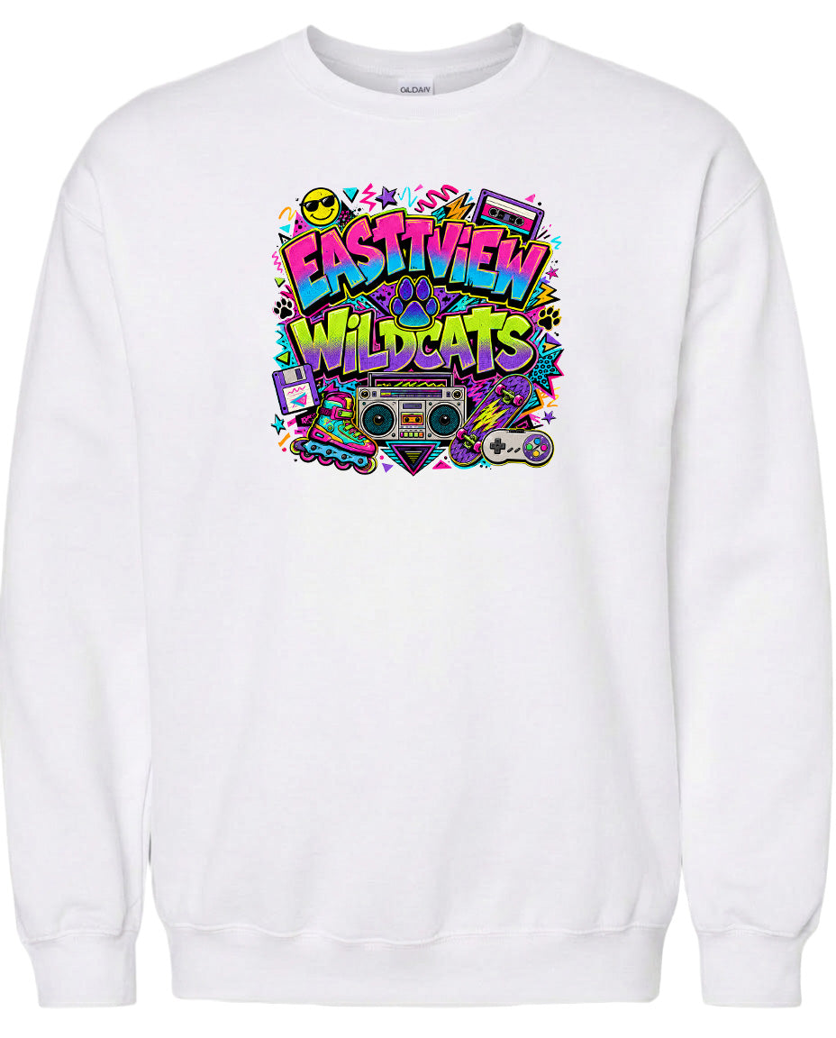 A white sweatshirt with a colorful graphic design featuring the text "EASTVIEW WILDCATS" surrounded by various icons and symbols, such as a boombox, skateboard, and other retro-style elements.