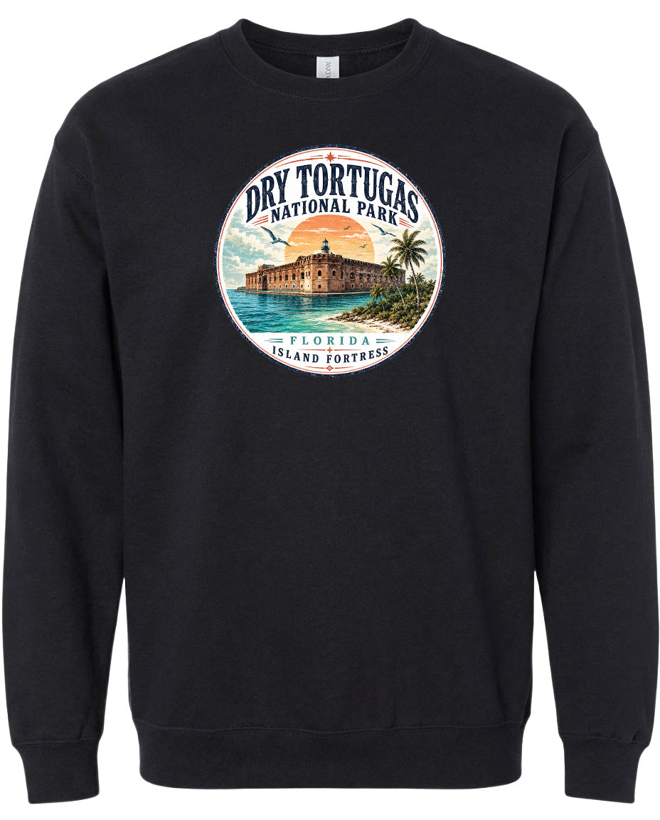 A black sweatshirt with a circular graphic design featuring a building and palm trees, along with the text "Dry Tortugas National Park, Florida Island Fortress".
