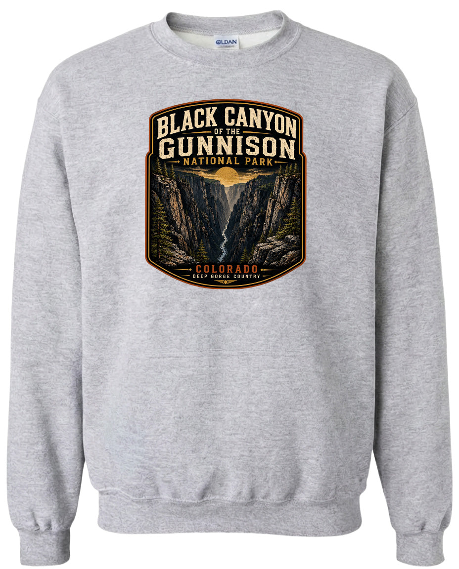 A gray sweatshirt with a graphic design depicting the Black Canyon of the Gunnison National Park in Colorado.